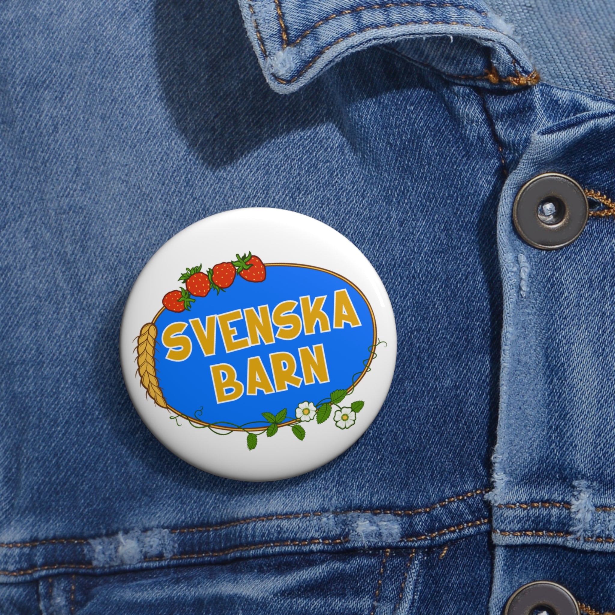 Svenska Barn logo enamel pin worn on denim jacket