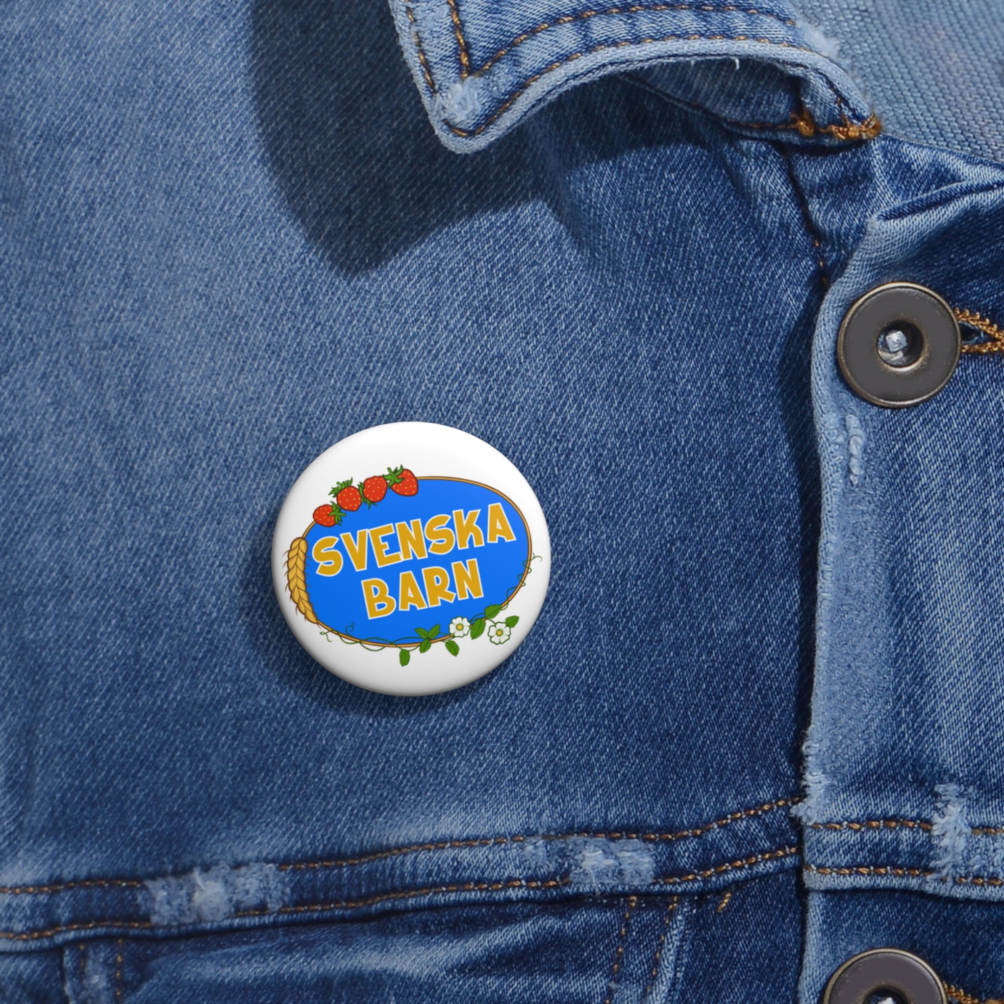 Svenska Barn logo enamel pin worn on denim jacket