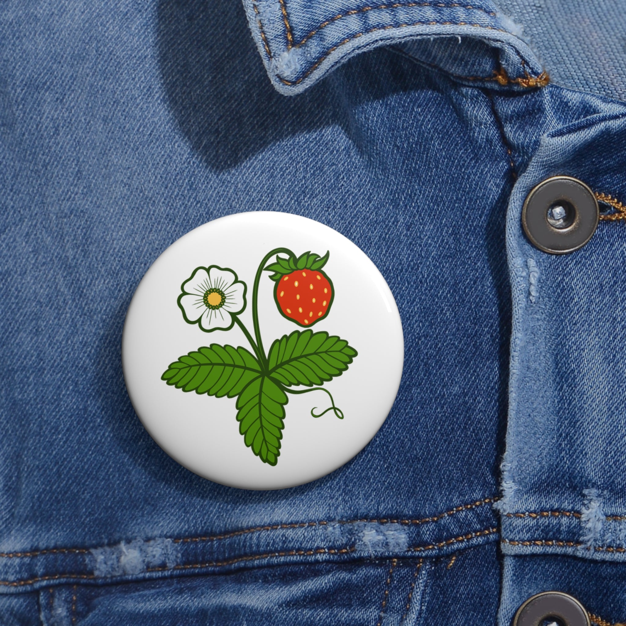 Smultron enamel pin worn on denim jacket